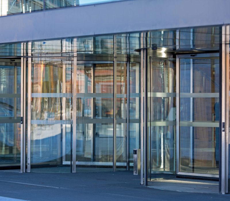 automatic-revolving-doors-at-modern-building-entra-2025-10-06-20-18-35-utc