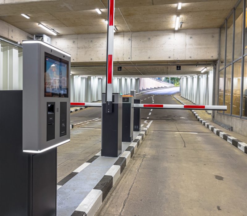 Barrier at Entrance and Exit of a car Parking garage. Fully automated barrier from car park. Underground parking, garage. Interior of parking