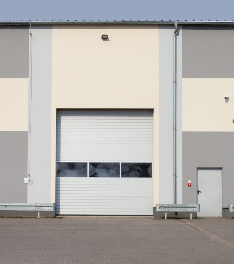 Gray iron shutter of an industrial building with gray color